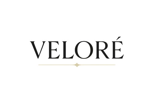 make a simple yet complex logo no to flashy and not to fancy but just a little bit luxurious with gold accents that says Veloré
